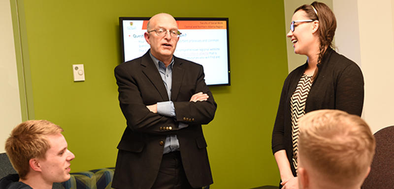 David Nicholas with students in social work's downtown Edmonton campus. "We need to address the void of structured, meaningful daily activities for adults with developmental disabilities or autism."