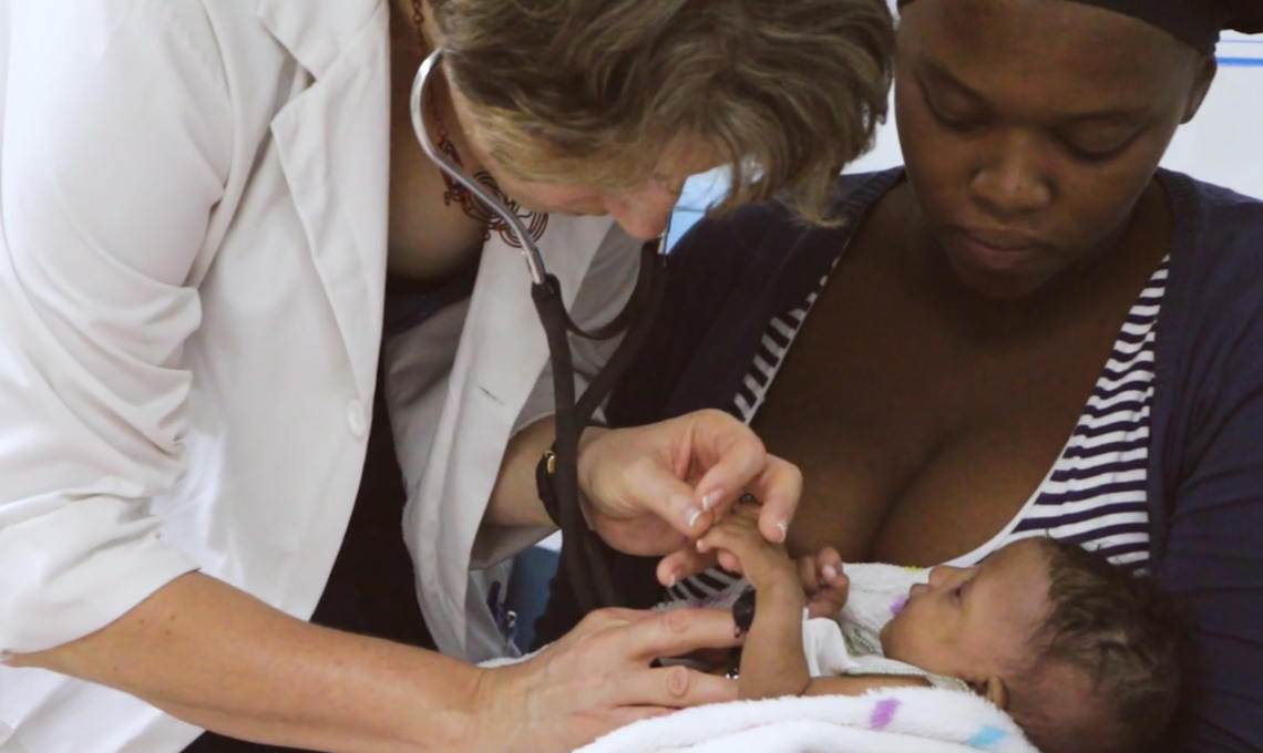Dr. Deb Isaac works with a congenital heart patient in Guyana. 