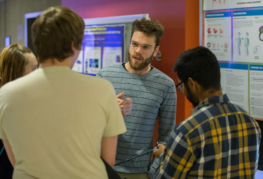 Jacob George and Riley Booth chat to guests about Re-able, a robotic elbow device to help stroke patients stretch, move and strengthen their arms, allowing for a better recovery. The team took part in the Summer Inc. program in 2017.