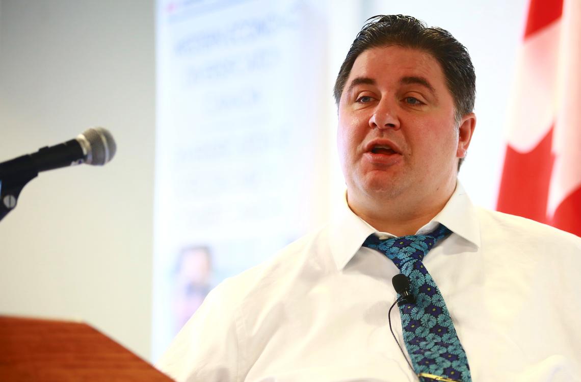 Kent Hehr, minister of sport and persons with disabilities, speaks at a University of Calgary news conference Dec. 12, 2017. 