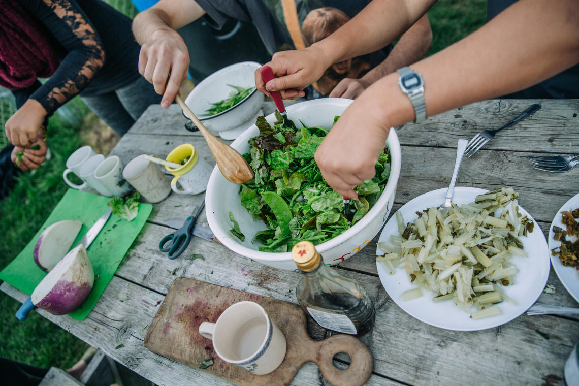 Community Garden Club members create a dinner for all participants of Thursgarden using food from the garden. 