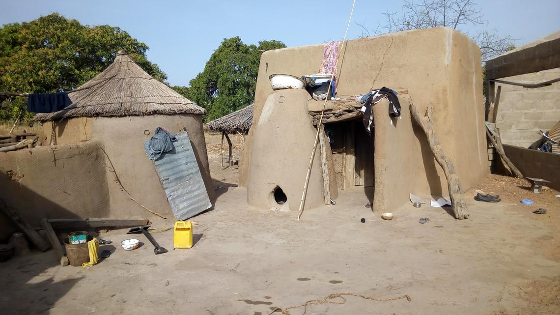 Mud huts in the farming village of Balansa, in Ghana, like the ones David Achuroa grew up in.