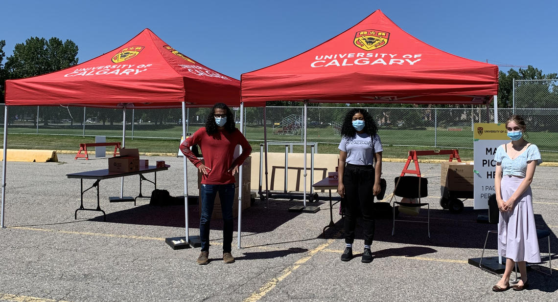 UCalgary volunteers distribute non-medical face coverings to the community.