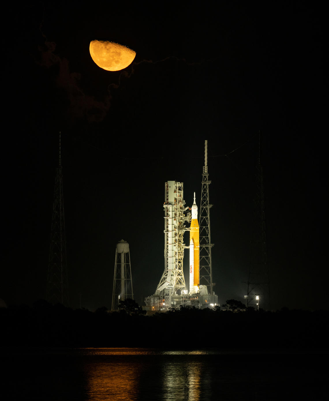 The Moon is seen rising above NASA’s Space Launch System (SLS) rocket with the Orion spacecraft aboard at Launch Pad 39B as preparations for launch continue, Monday, Nov. 14, 2022, at NASA’s Kennedy Space Center in Florida.