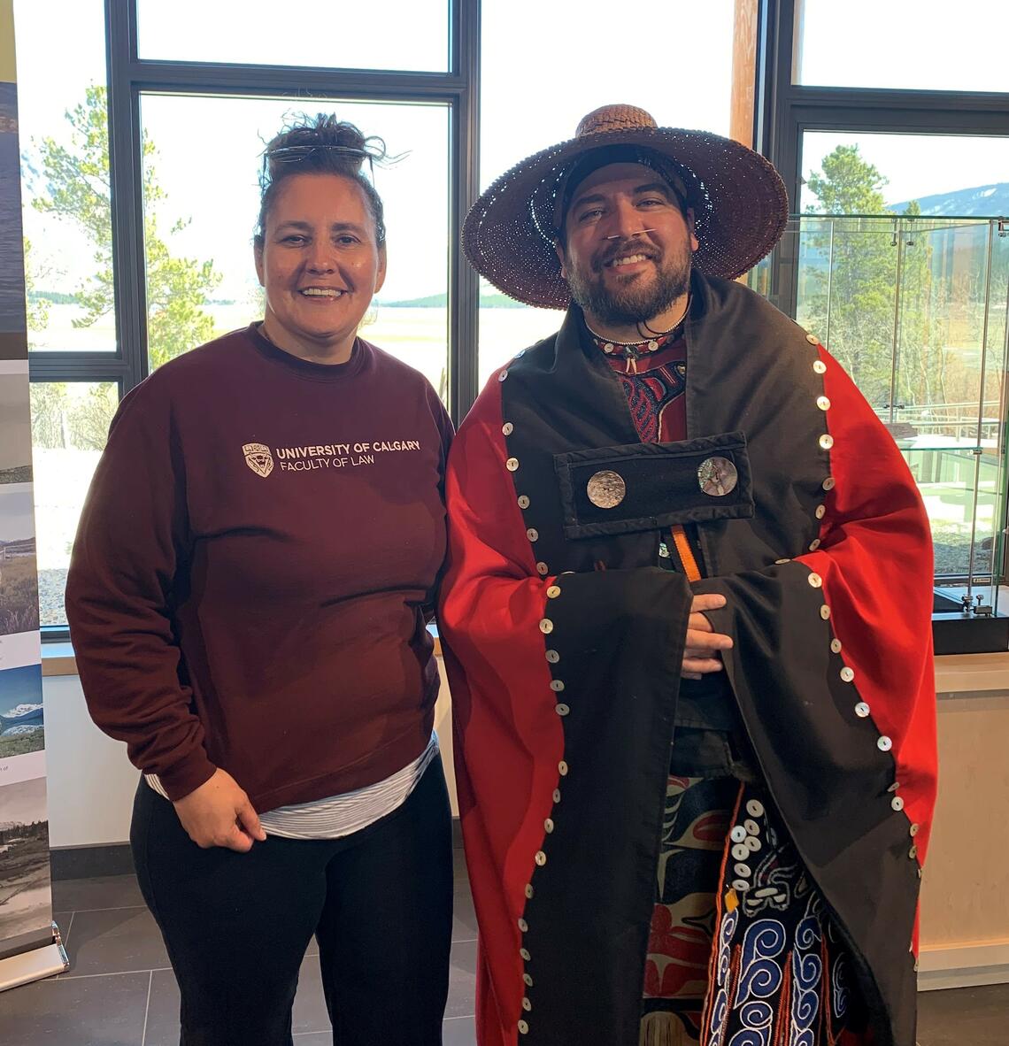 Colleen Chalifoux stands next to a man dressed in traditional Indigenous clothing during the course in the Yukon.
