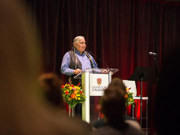 Reg Crowshoe, Piikuni elder and member of the University of Calgary Senate, gives blessings.
