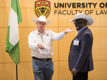 Dean Ian Holloway presented His Excellency Mr. Adeyinka Asekun with a white hat for Stampede.
