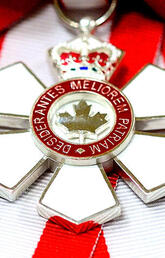 Two Order of Canada medals on a white, red and black background