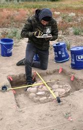 Student in excavation pit. 