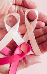 Hands holding oncology ribbons