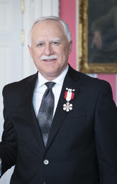 Governor General Julie Payette invests professor John Conly as a Member of the Order of Canada.