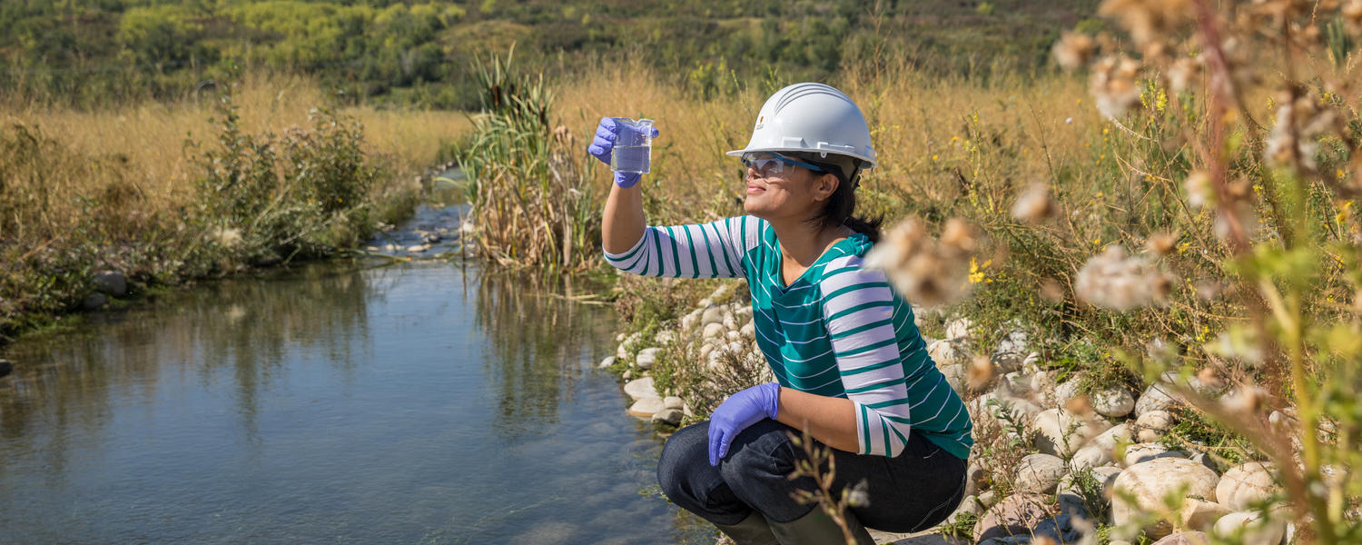 Engineer getting water sample