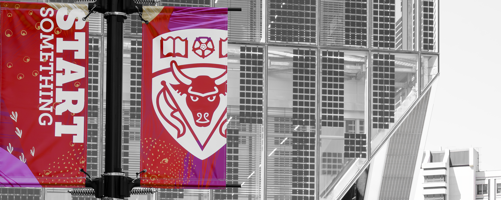 Full colour 'Start something' banners against a black and white image of the Hunter Student Commons