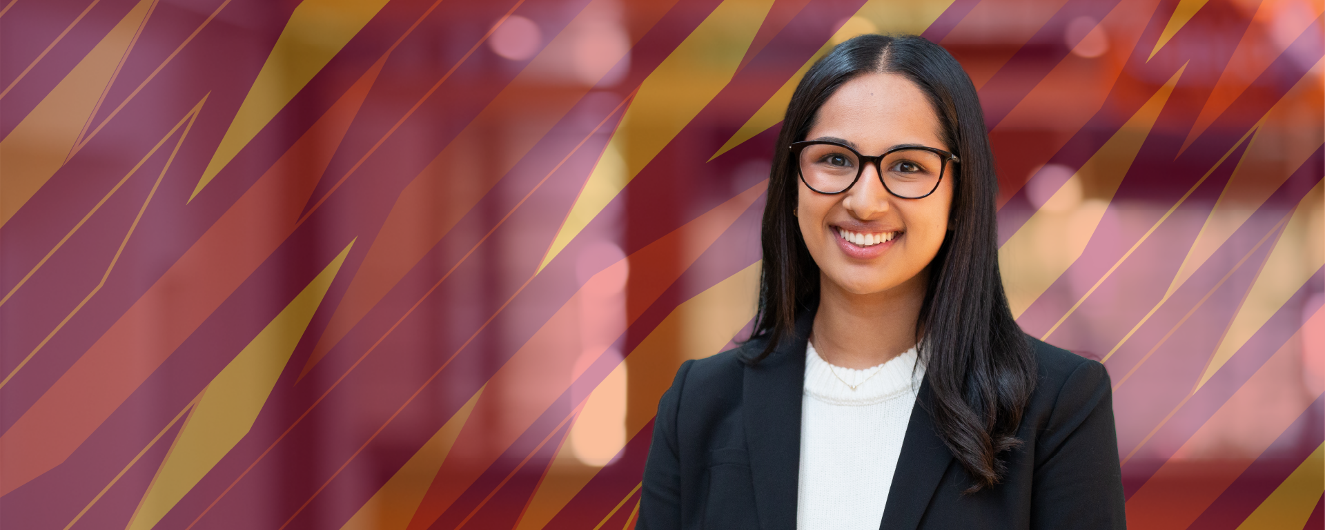 Headshot of a female student with the spark pattern behind her