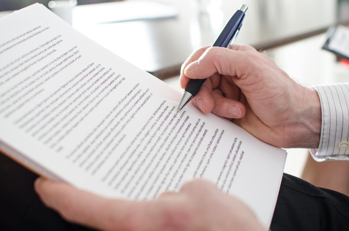 Hand hold pen and paper