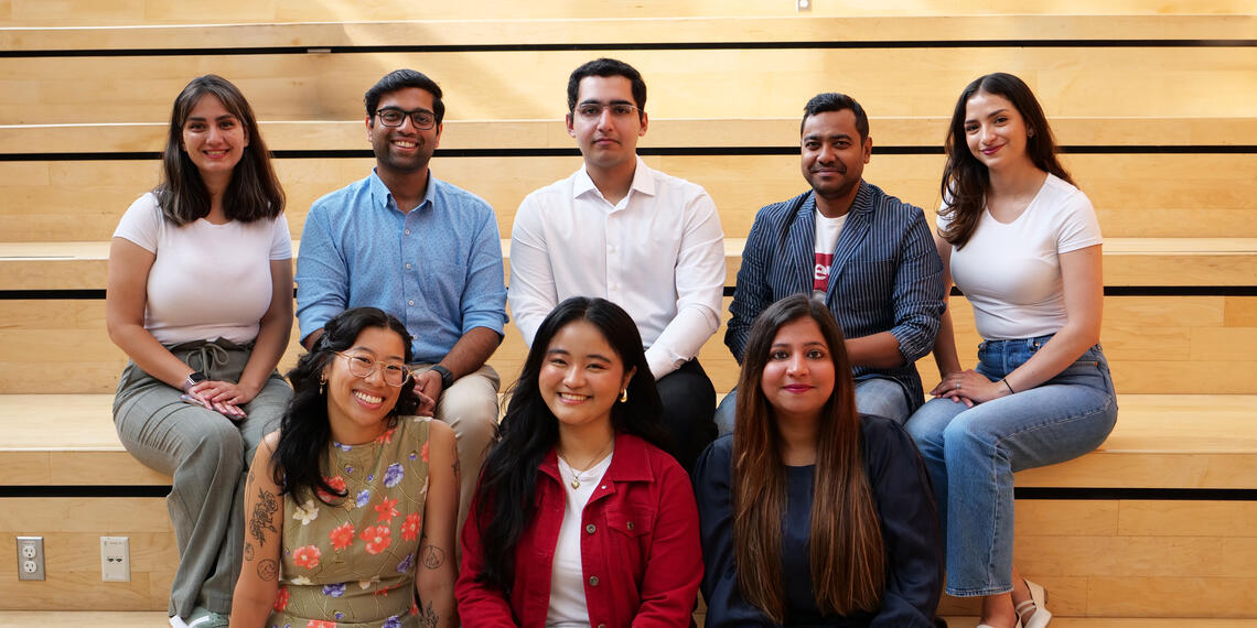 Grad Ambassadors sitting on stairs
