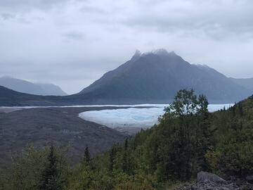 Photo of white and debris-covered glaciers