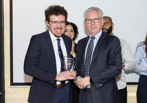 Photo of the 3MT winner with the President of UCalgary
