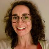 Woman with glasses smiling