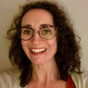 Woman with glasses smiling