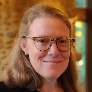 Photo of Dr. von Ranson; White woman with glasses, smiling