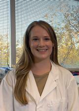 Headshot of Dana Lowry wearing a lab coat